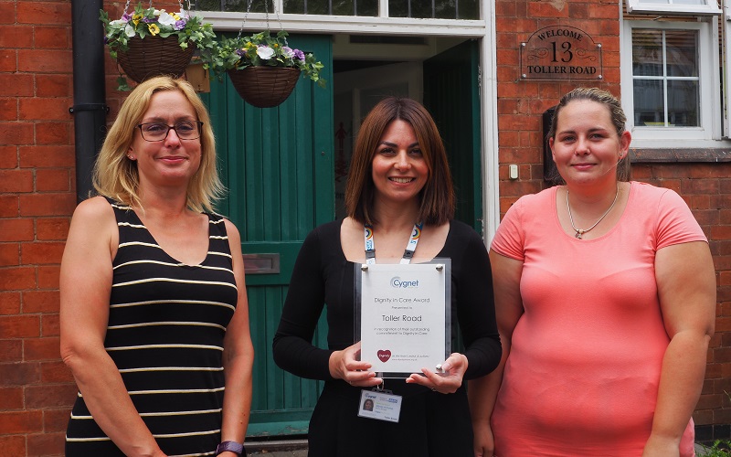 The team at Toller Road with their Dignity in Care Award