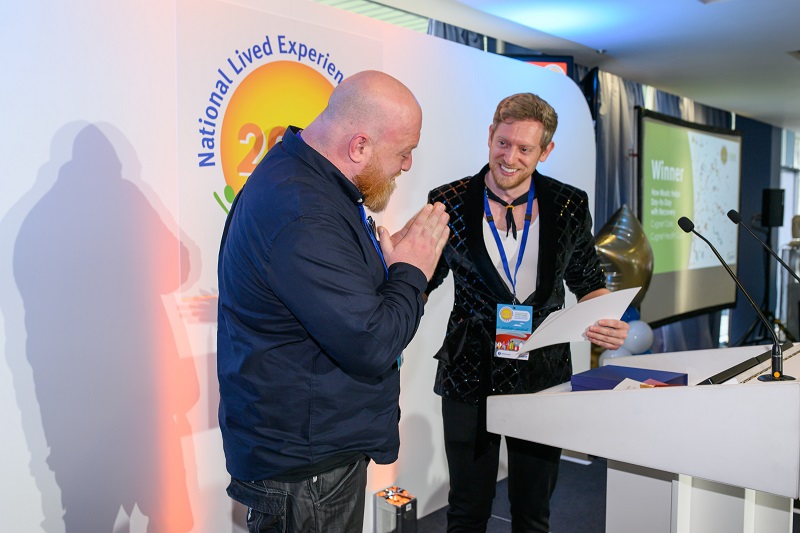 Chris receiving the award from Chris Truscott of the NHS Confederation